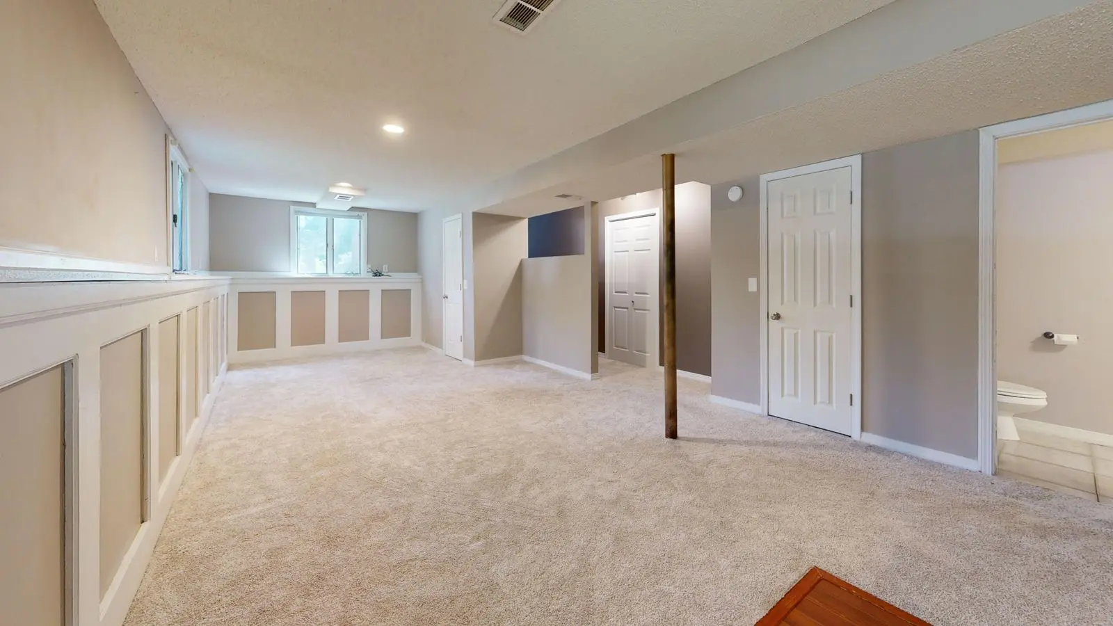 Finished basement of the kind a backup sump pump protects