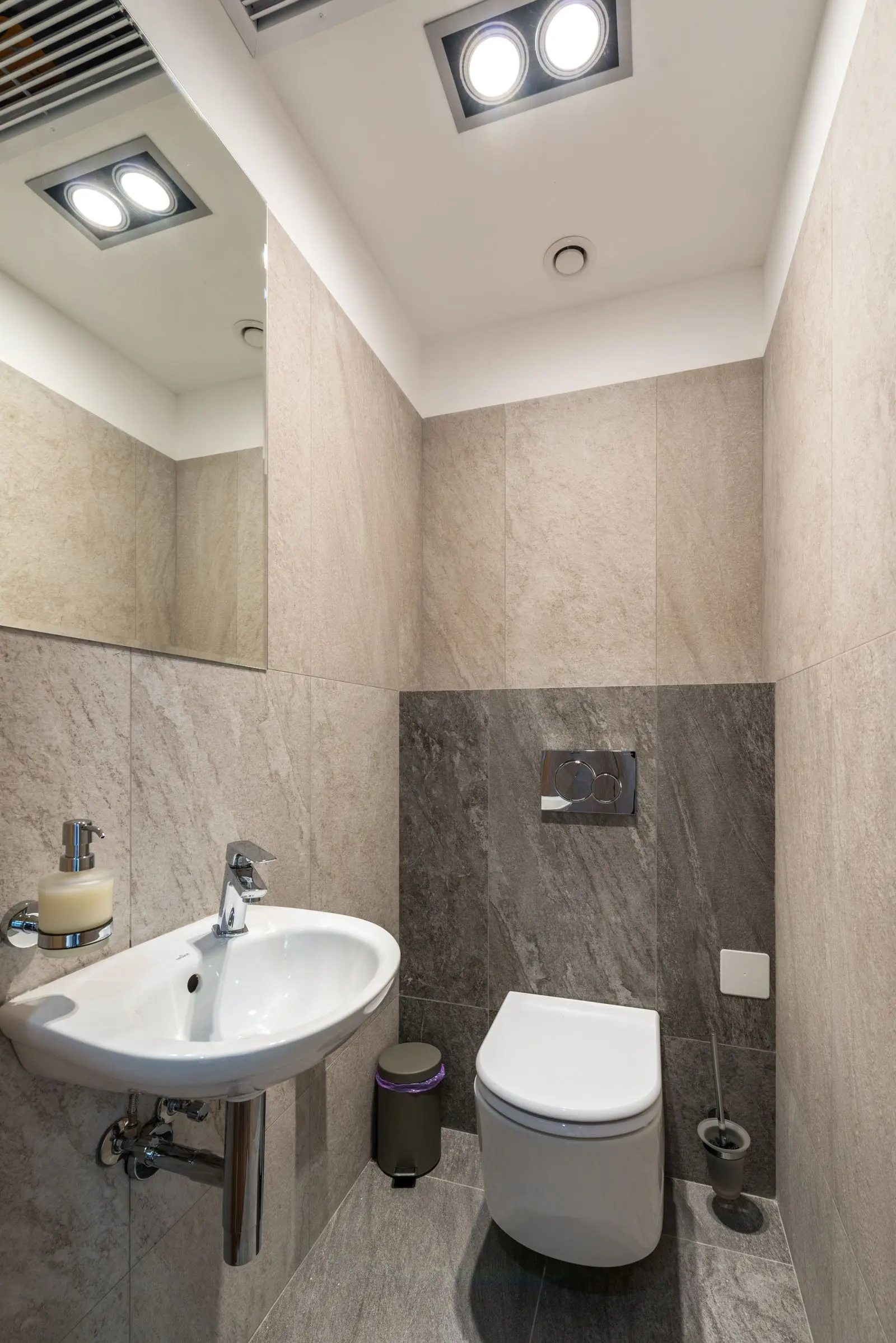 Tiled bathroom with a wall-mounted shower valve
